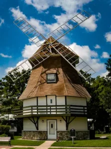 The Dutch Windmill Museum in Nederland, Texas, representing the primary service area for V Pro Towing’s local roadside assistance team.