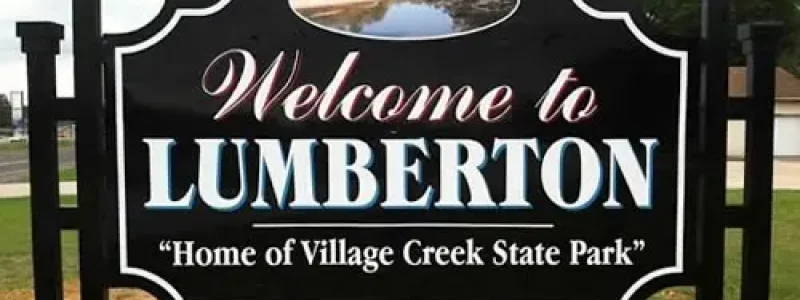 The "Welcome to Lumberton - Home of Village Creek State Park" city entrance sign, representing V Pro Towing’s dedicated service area in Lumberton and Hardin County.